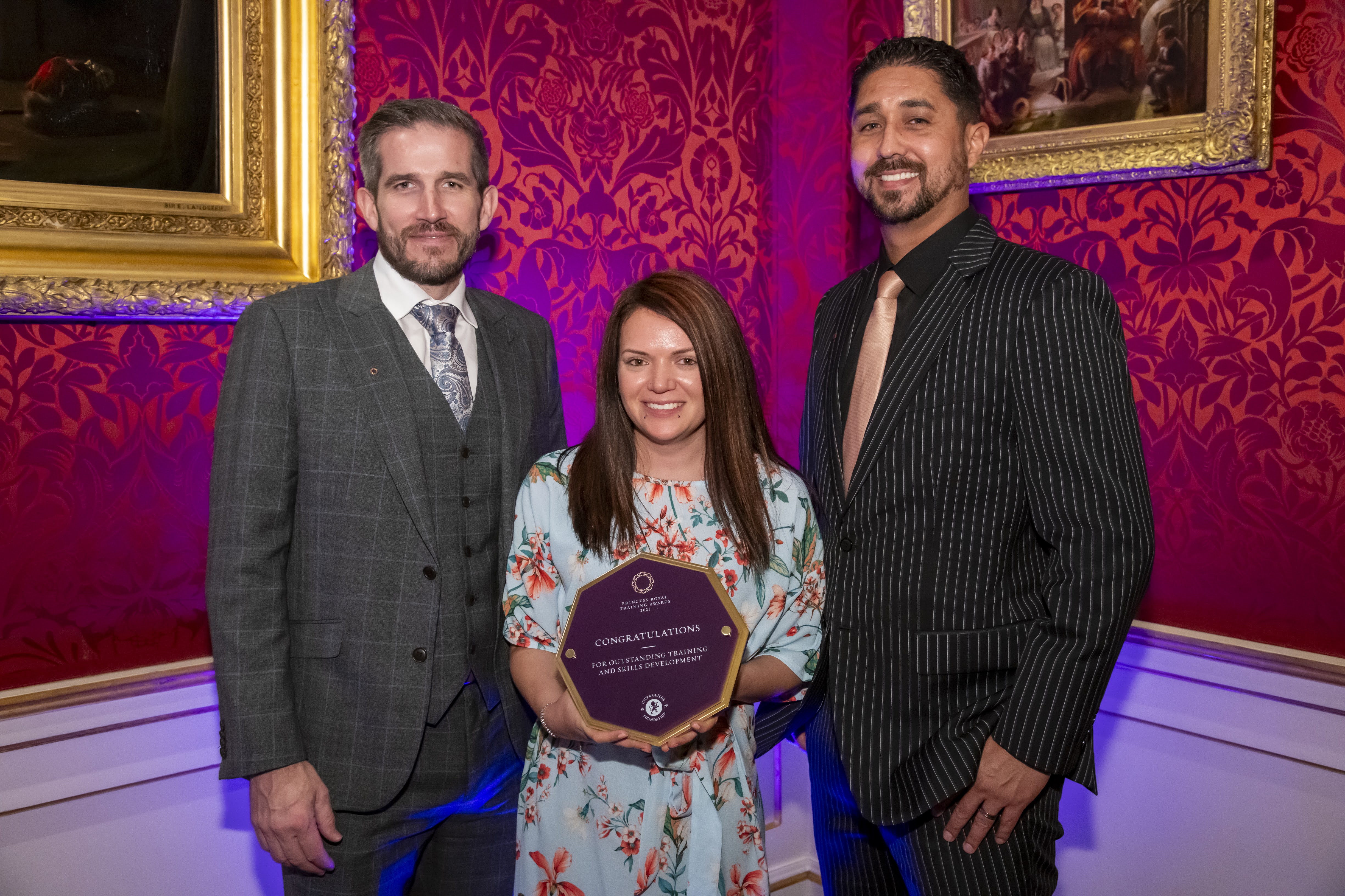 Our directors and Kayleigh holding an award.