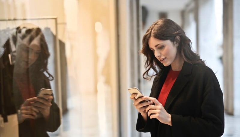 Someone using a mobile app while shopping